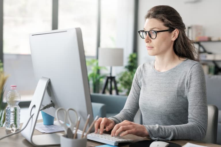Woman working from home on a computer