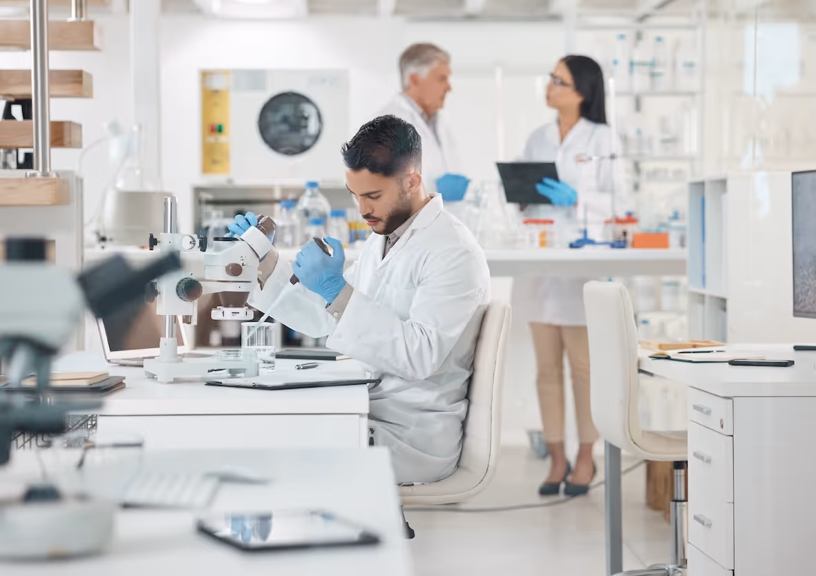 Three scientists working in laboratory