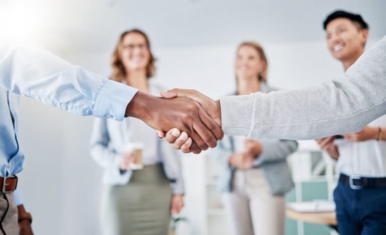 Business people shaking hands for partnership and collaboration