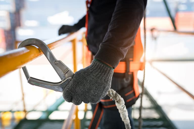 Lone worker clipped to scaffolding